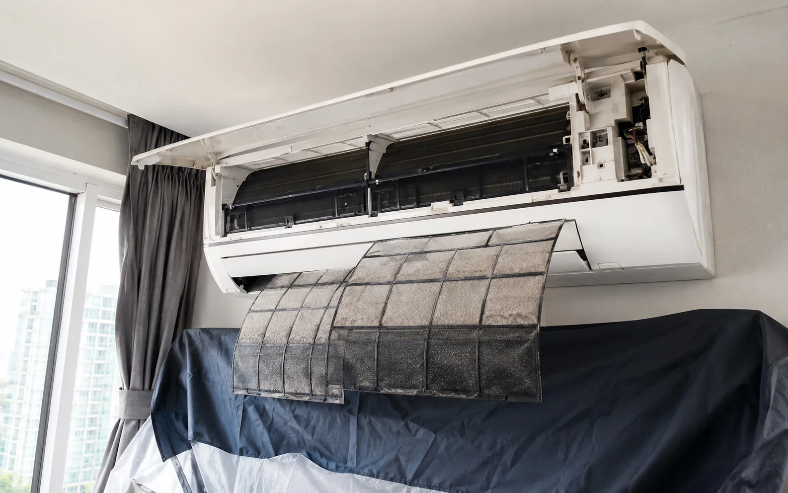Wall-mounted aircon unit prepared for general servicing in Singapore.