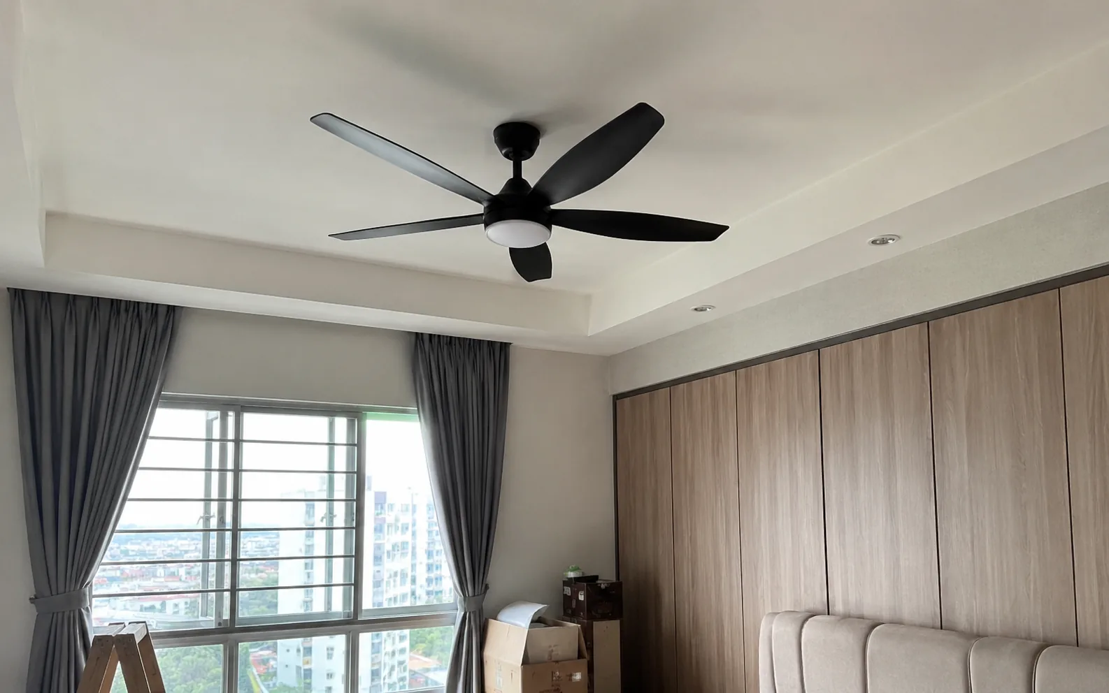 Electrical ceiling fan installation in a Singapore home.