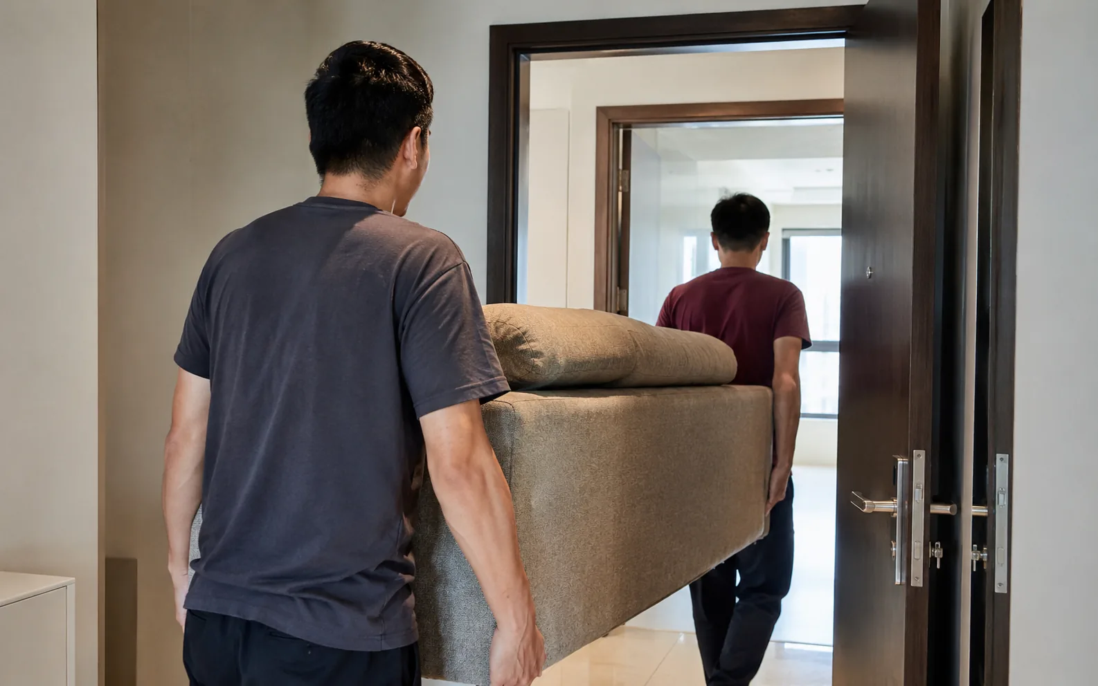 Movers handling furniture in Singapore.