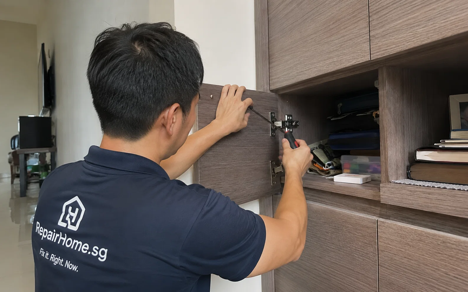 Handyman carrying out minor home repairs in Singapore.