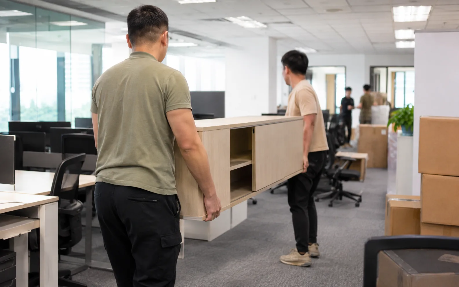 Movers handling an office move in Singapore.