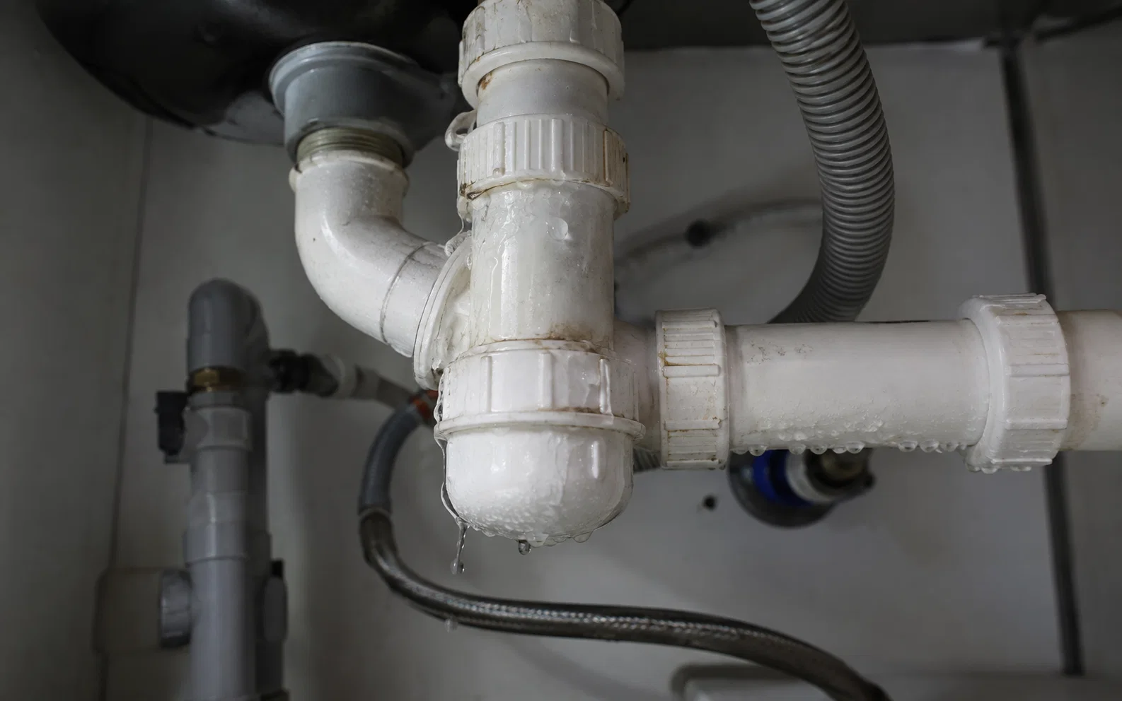 Leaking household pipe requiring repair in Singapore.