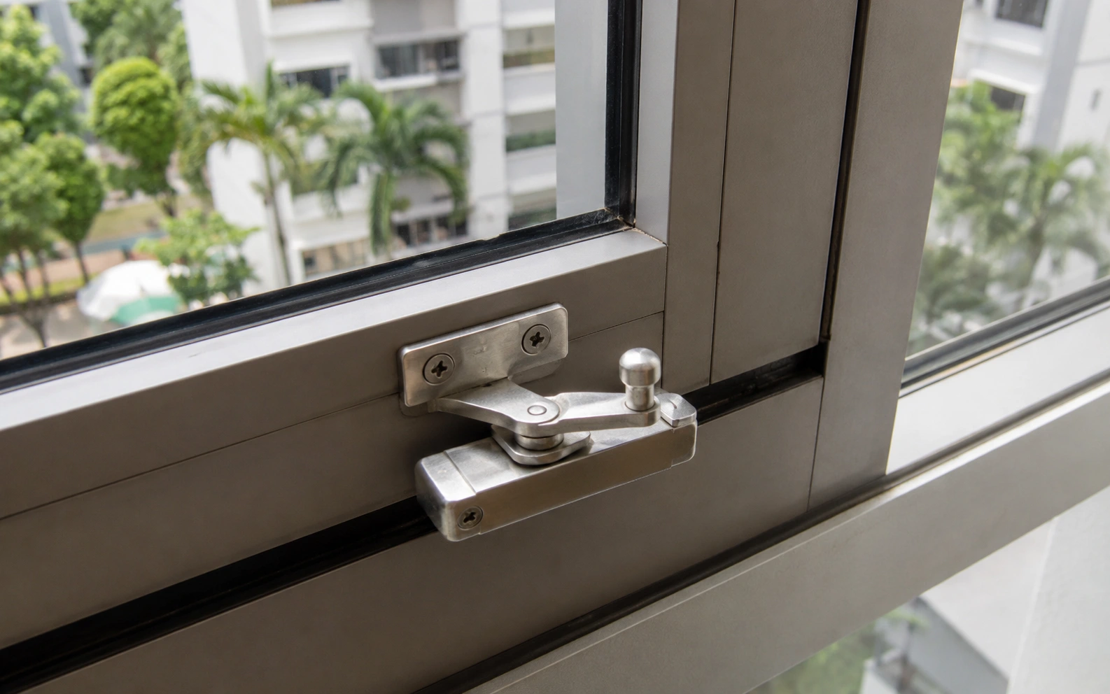 Technician repairing a sliding window in a Singapore home.