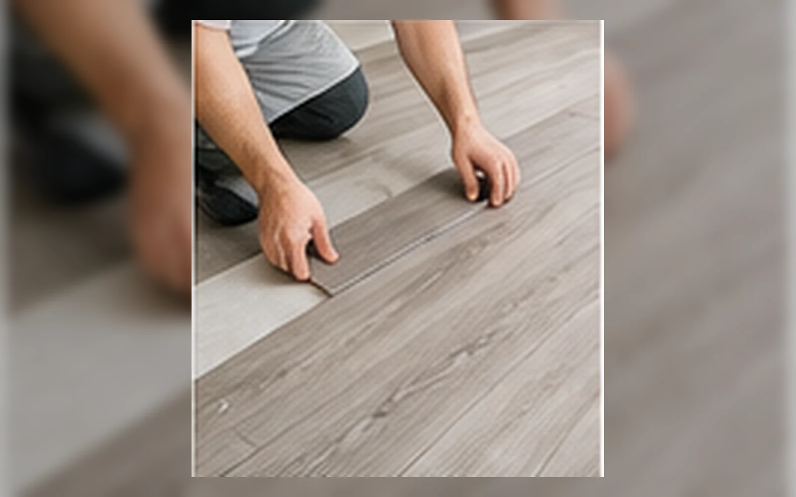 Installer laying vinyl flooring in Singapore.