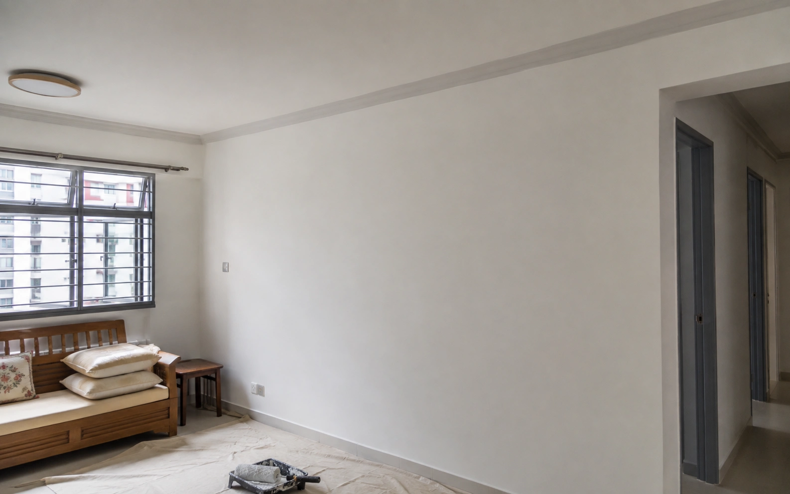 Technician aligning an aluminium window in Singapore.